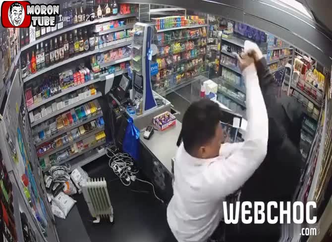 Video :An armed robber is placed on the run by a careless shopkeeper